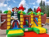 a inflatable bounce park with a clown on it at Mobilehome climatisé avec TV pour 4 à 6 personnes in Boofzheim