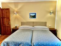 Postel nebo postele na pokoji v ubytování Hotel La Rivera