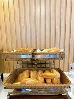 four trays of bread in baskets on a table at Việt Úc Flower Garden in Kon Von Kla