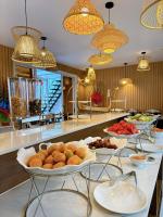 a buffet with several plates of food on a counter at Việt Úc Flower Garden in Kon Von Kla