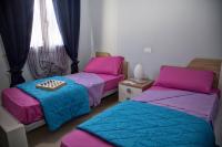 Posteľ alebo postele v izbe v ubytovaní La Conchiglia Case Vacanze