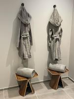 a display of towels hanging on a wall at La Pavoyère in Mormoiron