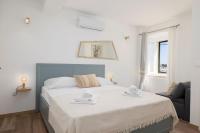 Posteľ alebo postele v izbe v ubytovaní Jasminka apartments