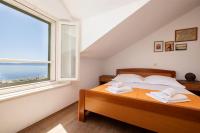 Posteľ alebo postele v izbe v ubytovaní Jasminka apartments