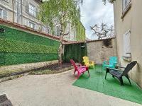 a group of chairs sitting in front of a building at Logement 4 personnes avec terrasse privative ! in Meaux
