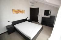 A bed or beds in a room at Appartamenti Colombo