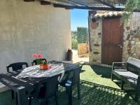 A patio or other outdoor area at "The Cottage"with sea view, parking & wifi