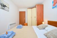 Posteľ alebo postele v izbe v ubytovaní Apartment Promenada- 4pax with Parking