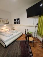 a bedroom with a bed and a glass table at Have a nice home in Leipzig