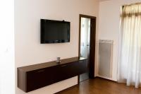 Televízia a/alebo spoločenská miestnosť v ubytovaní Apartmán Tále č.309