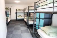 a room with four bunk beds in a dorm at Nomads St Kilda in Melbourne