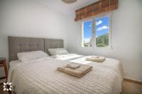 Postel nebo postele na pokoji v ubytování Villa Condor by Abahana Villas