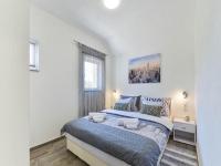 Łóżko lub łóżka w pokoju w obiekcie Pool apartment Leonardo