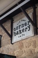 un cartello sul lato di un muro di mattoni di Old Town Corner Luxury Studios a Città di Rodi