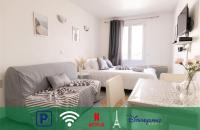 Telewizja i/lub zestaw kina domowego w obiekcie Cosy Appartement - 4 personnes - Disneyland & Paris