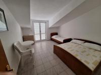Postel nebo postele na pokoji v ubytování Anic Apartments Stanići