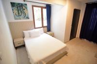 Postel nebo postele na pokoji v ubytování Ados Hotel