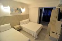Postel nebo postele na pokoji v ubytování Ados Hotel
