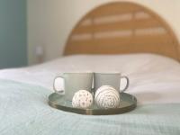 Llit o llits en una habitaci&oacute; de Chez Colette