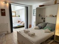 a bedroom with a large bed with towels on it at FLC-Sea View-Jacuzzi-3 Bedrooms-8p-Parking for 2 cars in Marseille