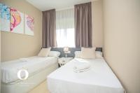 Posteľ alebo postele v izbe v ubytovaní Holiday Deluxe Apartment Miramar Magic World