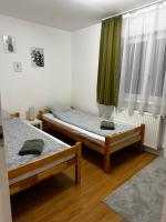 Łóżko lub łóżka w pokoju w obiekcie BükkRoseHill