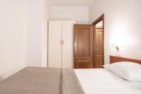 Postel nebo postele na pokoji v ubytování Old Town - Hall Square Apartment
