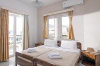 Posteľ alebo postele v izbe v ubytovaní Litsa Mare Apartments
