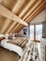 Łóżko lub łóżka w pokoju w obiekcie Chalet Le Méan-Martin