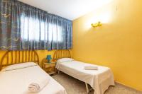 Postel nebo postele na pokoji v ubytování PARADIS 2 Planet Costa Dorada
