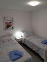 Postel nebo postele na pokoji v ubytování Sunbeach Apartment La Tejita