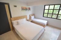 Postel nebo postele na pokoji v ubytování Ados Hotel