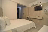 Postel nebo postele na pokoji v ubytování Ados Hotel