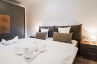 A bed or beds in a room at Appartementanlage Thermenblick SKI IN & SKI OUT