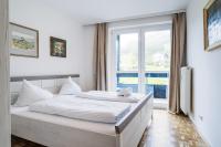 A bed or beds in a room at Appartementanlage Thermenblick SKI IN & SKI OUT