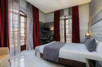 A bed or beds in a room at Hotel Ciutadella Barcelona