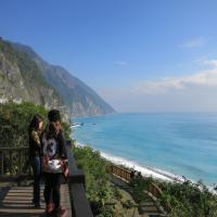 two women standing on a staircase looking at the beach at Taroko Susi Space in Xincheng