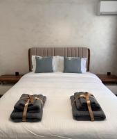 Postel nebo postele na pokoji v ubytování Premium Suites