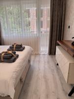 Postel nebo postele na pokoji v ubytování Premium Suites
