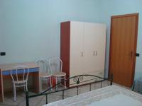 A bed or beds in a room at Le Tre Rose di Maria