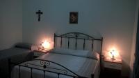 A bed or beds in a room at Le Tre Rose di Maria