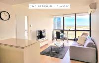 Melbourne Lifestyle Apartments - Best Views on Collinsにあるテレビまたはエンターテインメントセンター