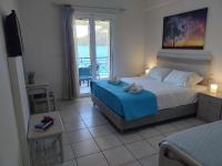 Posteľ alebo postele v izbe v ubytovaní Captain Nick Aparthotel