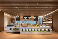 a kitchen with a counter with fruits and vegetables at Hilton Hotel by Hampton Wuhan Zhongnan Street Branch in Wuhan