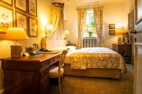 Schloss Auel Boutique Hotel & Design Golf Lodgeにあるベッド
