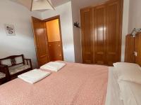 A bed or beds in a room at BPIRINEOS-Las Plazas