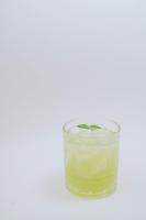 a glass filled with a candle on a white background at Marina Palawan Boutique Nature Resort in Puerto Princesa City