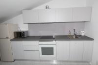 Kuchyň nebo kuchyňský kout v ubytování Rooms and Apartment Luana