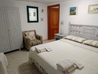 A bed or beds in a room at TITI' appartamento vacanze La Corte