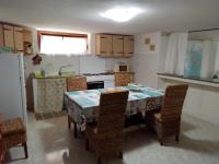 A kitchen or kitchenette at TITI' appartamento vacanze La Corte